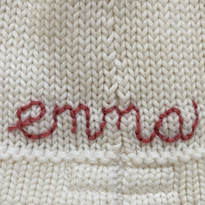 monogram [hand-stitched, back of hat]